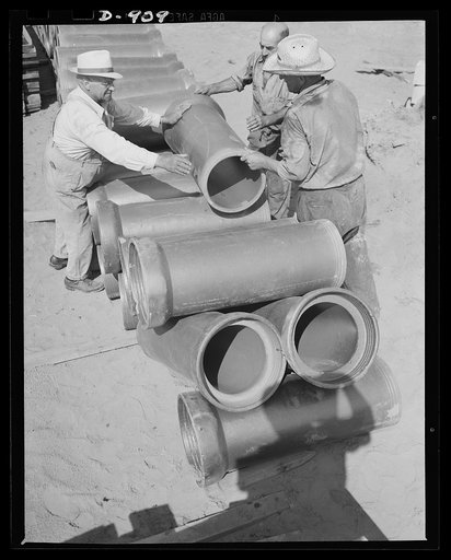 Defense housing, Erie, Pennsylvania. Sewage pipes are placed for the 300 defense homes at the Franklin Terrace housing project. Sewage, water, police and fire protection are provided by the city for a lump sum paid in lieu of taxes
