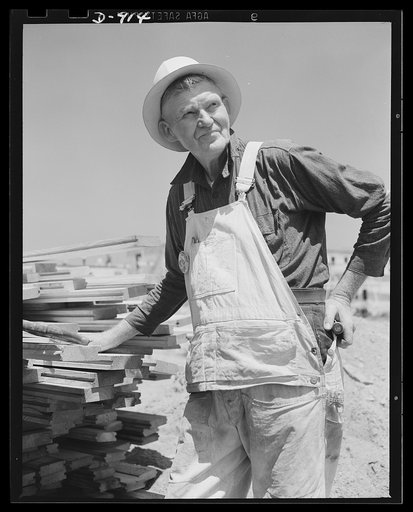 Defense housing, Erie, Pennsylvania. S.J. Patterson, carpenter, works on his second defense housing project. His first was during World War I at Fort Meade, Maryland
