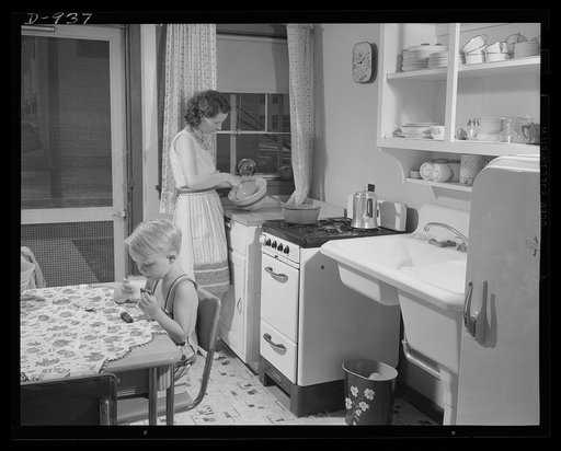 Defense housing, Erie, Pennsylvania. Bernie Rogan, son of Mr. and Mrs. B.J. Rogan, in the bathroom of the Rogan's new defense home at the Franklin Terrace housing project in Erie, Pennsylvania. His father is a drill press operator at the nearby plant of the General Electric Company, which is working
