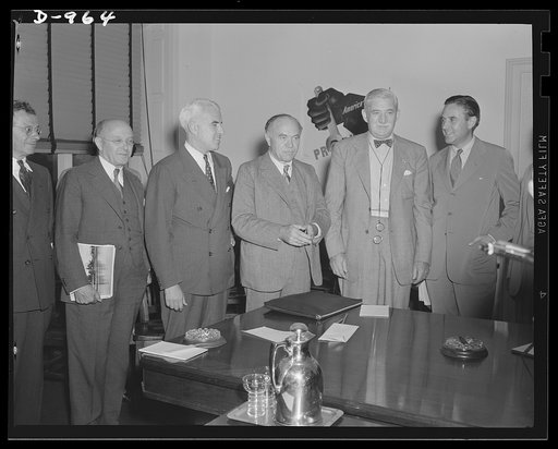 Conference held in the office of the Office of Production Management in Washington, D.C. August 19, 1941. Left to right: John Lord O'Brian, General Counsel, Office of Production Management; Edward R. Stettinius, Director of Priorities, OPM; Lord Beaverbrook, British Minister of Supply; William S. Kn