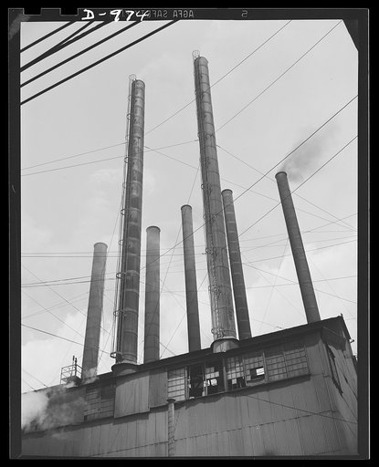 Steel alloy manufacture. Allegheny Ludlum Steel Corporation, Brackenridge, Pennsylvania. Power for the wheels of defense industry. The power house which generates all the steam required in this plant. The heavy wires in the foreground carry current to the electric melting furnaces