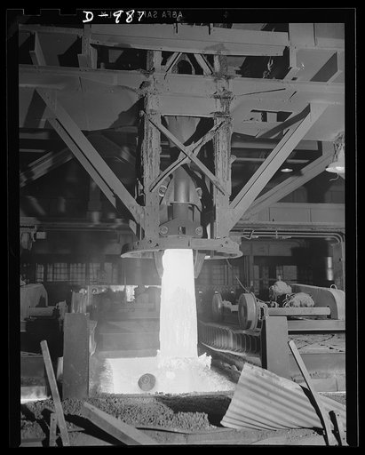 Steel alloy manufacture. Allegheny Ludlum Steel Corporation, Brackenridge, Pennsylvania. A heated ingot of steel is removed from the soaking pit. In this pit ingots are thoroughly heated to the extremely high temperature required for conversion into slabs, billets or sheet bars for further conversio