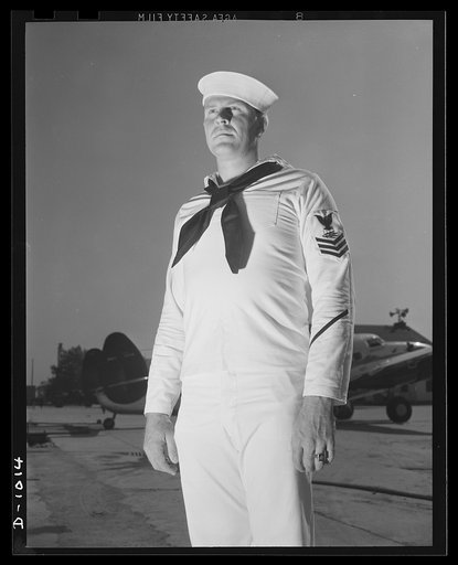 Naval Uniforms. John Marshall Evans, Radioman, first class. Radioman Evans' uniform is the white service dress worn both aboard the ship and at shore station during the summer months or in the tropics. Naval Air Station, Anacostia, Washington, D.C. August 21, 1941