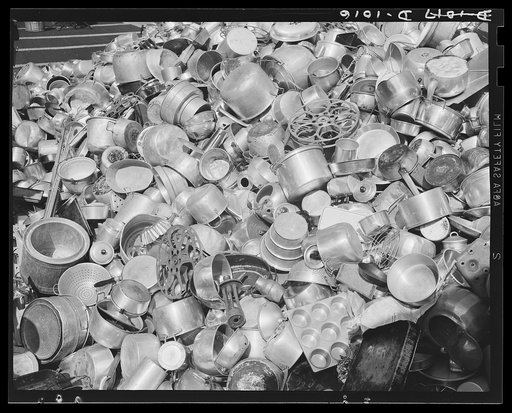 Aluminum collection. A store window display in New York, New York, promoting the National Defense Aluminum Collection (July 21-29, 1941). This collection was conducted by the Office of Civilian Defense and some of the aluminum obtained will be for use in industries producing for national defense. Mu