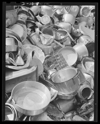 Aluminum collection. A store window display in New York, New York, promoting the National Defense Aluminum Collection (July 21-29, 1941). This collection was conducted by the Office of Civilian Defense and some of the aluminum obtained will be for use in industries producing for national defense. Mu