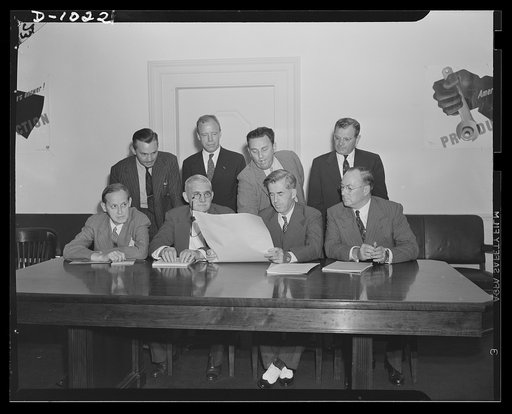 The first meeting of the Supply Priorities and Allocations Board, Washington, D.C., September 2, 1941. Seated left to right: Harry L. Hopkins, Special Assistant to the President, supervising lend-lease Program; William S. Knudsen, Director-General of the Office of Production Management (OPM); Henry 