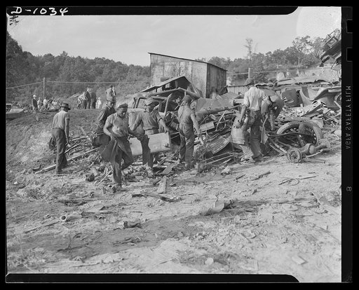 Conservation. Scrap iron and steel. An automobile graveyard outside Baltimore, Maryland. Scrapped oars are collected in such yards in every state. Usable parts are stripped from the chassis and the remainder of the car is sent to scrap iron dealers for processing and shipment to steel mills