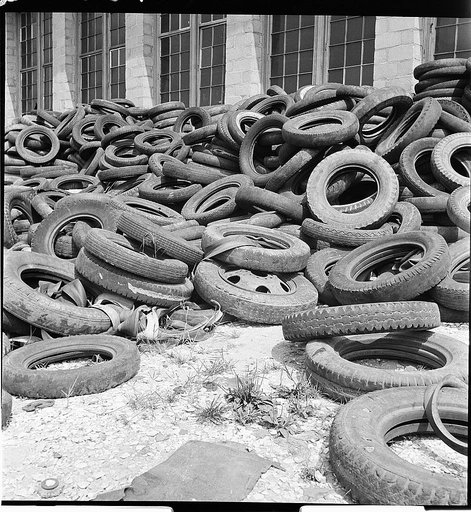Conservation. Scrap iron and steel. Tires reclaimed from automobiles, scrapped for their iron and steel content. The rubber content of these tires can be reclaimed successfully to replace the use of new rubber in many articles. The U.S. Army is experimenting at the moment with the use of retreaded t