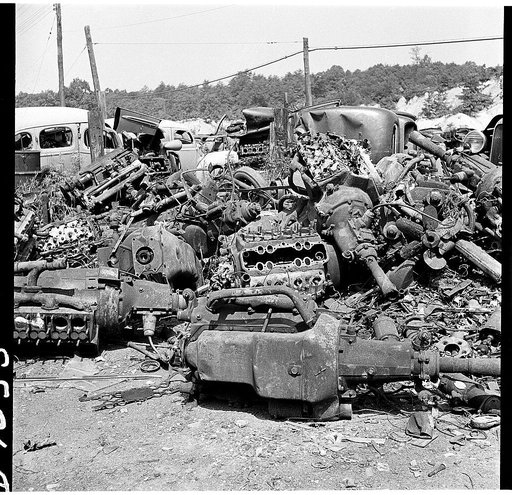 Conservation. Scrap iron and steel. Auto "graveyards" where old worn out automobiles are stripped of usable parts. Non-ferrous materials are burned out and the steel chassis and bodies are sent on to scrap iron and steel dealers. Such yards as these supply tons of scrap iron, steel and rubber yearly