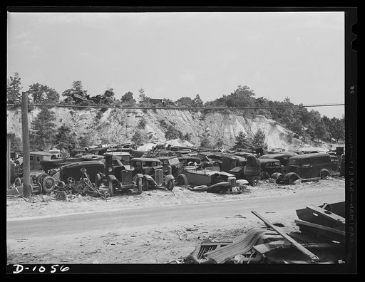 Conservation. Scrap iron and steel. Auto "graveyards" where old worn out automobiles are stripped of usable parts. Non-ferrous materials are burned out and the steel chassis and bodies are sent on to scrap iron and steel dealers. Such yards as these supply tons of scrap iron, steel and rubber yearly