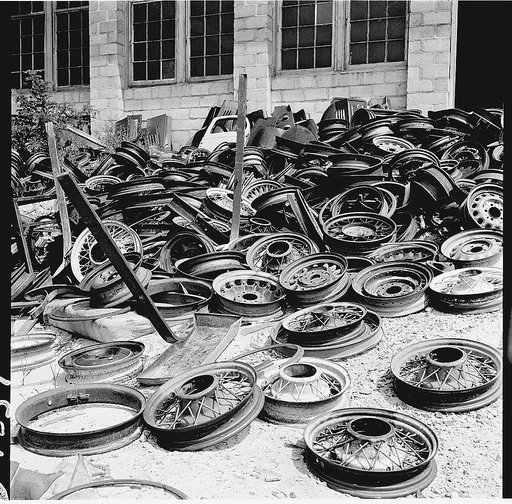 Conservation. Scrap iron and steel. Auto "graveyards" where old worn out automobiles are stripped of usable parts. Non-ferrous materials are burned out and the steel chassis and bodies are sent on to scrap iron and steel dealers. Such yards as these supply tons of scrap iron, steel and rubber yearly