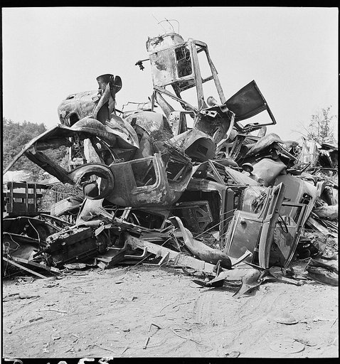 Conservation. Scrap iron and steel. Auto "graveyards" where old worn out automobiles are stripped of usable parts. Non-ferrous materials are burned out and the steel chassis and bodies are sent on to scrap iron and steel dealers. Such yards as these supply tons of scrap iron, steel and rubber yearly