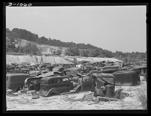 Conservation. Scrap iron and steel. Auto "graveyards" where old worn out automobiles are stripped of usable parts. Non-ferrous materials are burned out and the steel chassis and bodies are sent on to scrap iron and steel dealers. Such yards as these supply tons of scrap iron, steel and rubber yearly
