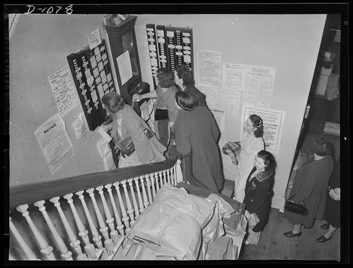 Women in defense. Women employees checking in for the second shift at the Schaeffer Tent and Awning Company, Denver, Colorado. These women are employed in the manufacture of eight-man pyramidial tents to house the expanding defense army in the field