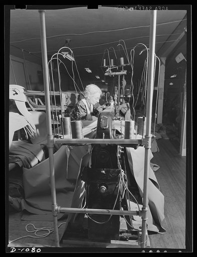 Army tent manufacture.  Schaeffer Tent and Awning Company, Denver, Colorado. Tents for the expanding defense army in the field. Ninety-five pyramidal eight-man tents are turned out everyday in this small plant, under the rigid specifications laid down by the Army Quartermaster Corps. Joining seven w