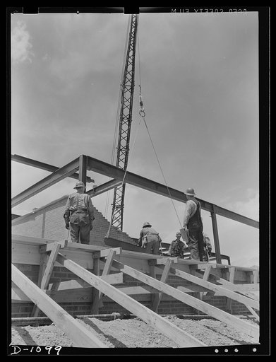 Plant construction. Denver ordnance plant, Denver, Colorado. Steel rigging during the construction of one of the steel brick buildings at the Denver ordnance plant which will produce small arms ammunition. Other buildings at this plant are of reinforced poured concrete construction