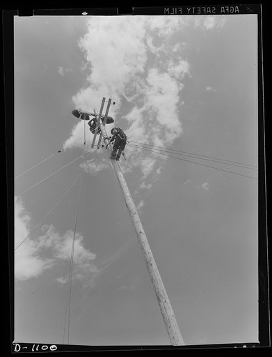 Plant construction. Denver ordnance plant, Denver, Colorado. Lineman bringing power to the ordnance plant at Denver, Colorado, which will produce small arms ammunition