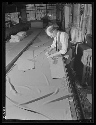 Army uniform trouser manufacture. Kane Manufacturing Company, Louisville, Kentucky. Cotton khaki and wool serge trousers are turned out here at the rate of 1300 a day to the designs and rigid specifications of the Army Quartermaster Corps. 34 sizes ranging from a small 28 inch waist with 29-inch leg