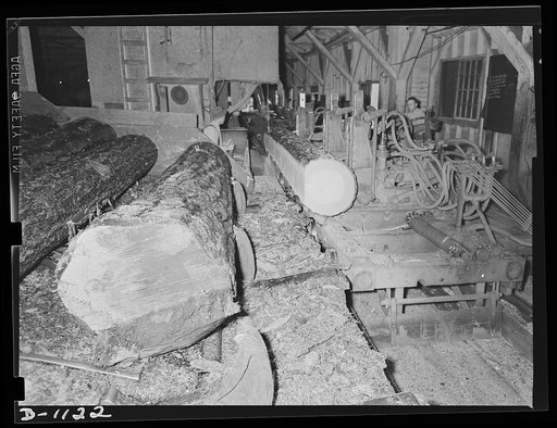 Lumber manufacture. Boise Payette Lumber Company, Boise, Idaho. On this hear rig (leg carriage) the logs are sliced down to Ponderosa pine boards, many of which are being used for defense construction