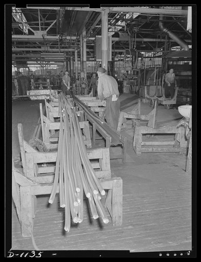 Aluminum. Reynolds Metal Company, Louisville, Kentucky. Rolled "strong alloy" aluminum rod stock as it comes from the rolling mill. This stock has been reduced to 1 3/8" in diameter