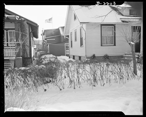 Dante Electric Company, Bantam, Connecticut. The family clothesline stretches from the back porch of the Dante home to a corner of the backyard factory. That's the entrance to the shop offices, facing the rear of the house