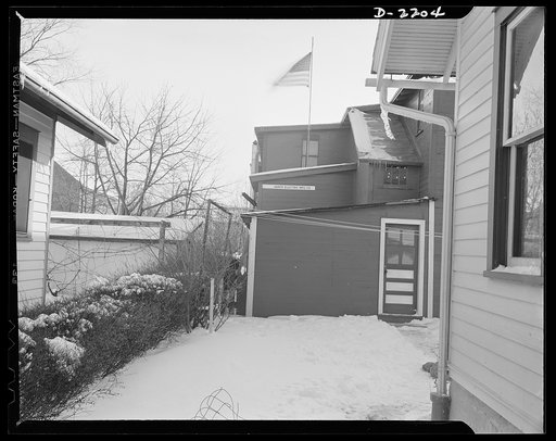 Dante Electric Company, Bantam, Connecticut. The family clothesline stretches from the back porch of the Dante home to a corner of the backyard factory. That's the entrance to the shop offices