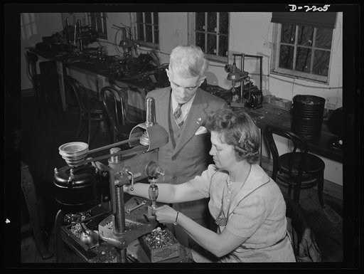 Dante Electric Company, Bantam, Connecticut. Mr. Dante looks on as Mrs. Hazel Wheeler places screws into electric terminals. Mrs. Wheeler, who lives in Bantam with her husband, a machinist at the Warren McArthur Plant there, was in a happy state of mind when this picture was taken. She has just lear
