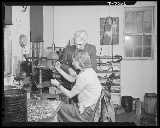Dante Electric Company, Bantam, Connecticut. Mrs. Arthur Shaw is another resident of Bantam. Her husband is a private chauffeur in Litchfield. Mr. Dante is watching her operate a small drill press. Mrs. Shaw has volunteered to serve as one of Bantam's air raid watchers, puts in several early morning
