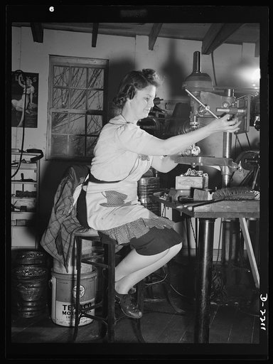 Mrs. Hazel Wheeler places screws into electric terminals. Mrs. Wheeler who lives in Bantam with her husband, a machinist at the Warren MacArthur Plant there, was in a happy state of mind when this picture was taken. She had just learned definitely that all was well with her son, attached to a naval 