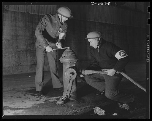 The air raid protective services. The speedy laying and coupling of firehose is often a difficult task, but it is essential if the auxiliary firemen are to function to the best advantage. They must learn to clamber like monkeys over debris, and must learn to estimate the strength of standing section