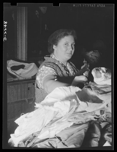 Rags Collection and processing. Women sorting rags in a large Eastern rag processing plant. After being sorted, the rags are compressed into tight bales for convenience in handling and storage. Old rags such as these are used in the manufacture of paper, roofing felt, fiber board, and similar materi