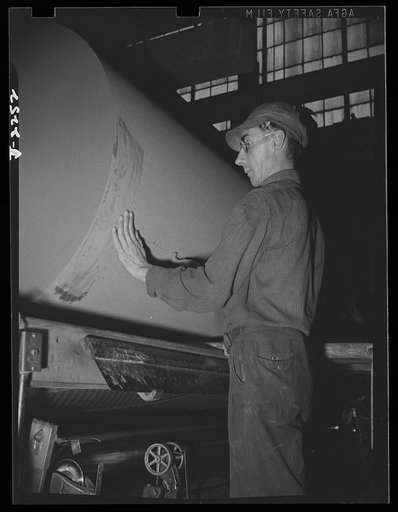 Rags. Collection and processing. A roll of roofing felt being sealed at a Maryland plant. Rags and waste paper are used extensively in the manufacture of this material. Shapiro Company, Baltimore, Maryland
