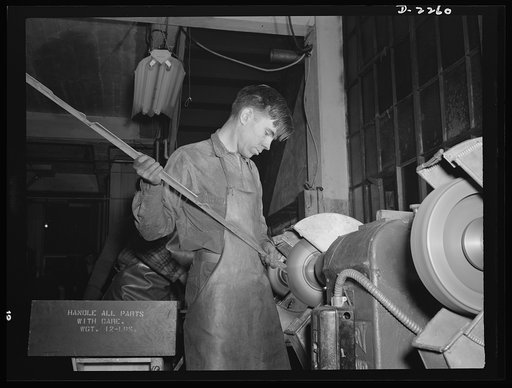 Bantam, Connecticut. Buffing aluminum supports for bomber seats is nineteen-year-old Gerard Gervais, who came to Bantam in the fall of 1941 with his older brother Ernest from Plainfield, Connecticut. The two brothers share a five-room house in Bantam with two aunts and an uncle, who also came to Ban