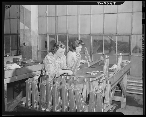 Bantam, Connecticut. Two Bantam girls are seen here burring aluminum castings for aircraft seats at the Warren McArthur plant. At the left is Marion Jefferies, who has been doing this work since December 1940. Jean Brunetto is the daughter of Mike Brunetto, who operates a popular dine-and-dance plac