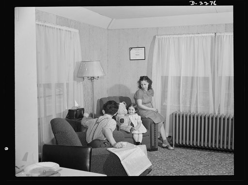 Bantam, Connecticut. Defense homes. Fred Heath works on the night shift at the Warren McArthur plant in Bantam, and spends his days with Mrs. Heath and their three-year-old daughter, Ann. Here they are in the living room of the Heath's new four-room apartment, part of the new eighty-unit defense hou