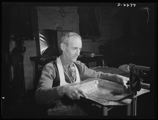 Bantam, Connecticut. Armand Langevin smoothes out aluminum dies with a power hammer. A native of Canada, Langevin has been at the Warren McArthur plant for several months. He lives in Bantam, sharing a five-room house with his wife, Regine, his sister Alice, both of whom work in the plant's upholste