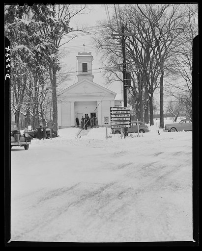 Bantam, Connecticut. 1942's first snow storm cut down attendance at the Episcopal Church, but even in good weather Bantam is not a community of churchgoers. Young Rev. H. Waldo Manly, who came to Bantam a few years ago from Washington, D.C., is president of the newly formed Bantam Lions Club. He say