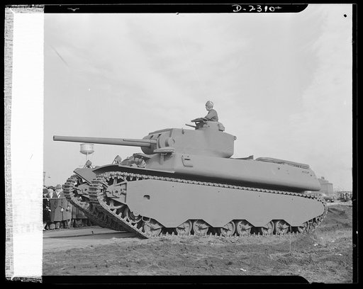 Delivery of the first heavy tanks. This is the new fifty-seven-ton tank, known as the M-1 in the initial demonstration. Notice that the gun turrets are on the top, making it possible for the tank to take advantage of irregular land, sheltering the lower part and shooting from revolving turrets on to