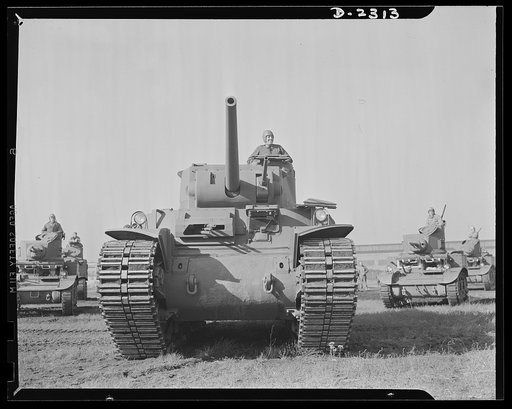 Delivery of the first heavy tanks. This is the new fifty-seven-ton tank, known as the M-1 in its initial demonstration. Notice that the gun turrets are on the top, making it possible for the tank to take advantage of irregular land, sheltering the lower part and shooting from revolving turrets on to