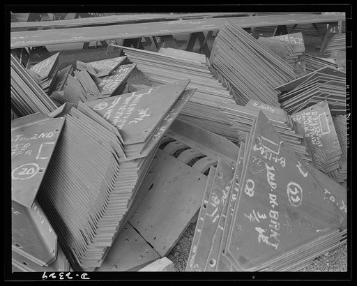 Shipbuilding. "Liberty" ships. These are shell frames and deck brackets ready to be welded between deck beams and frames for ship of the Liberty Fleet under construction at a large Eastern yard. All parts are prefabricated in this huge Eastern plant which formerly turned out freight cars. The comple