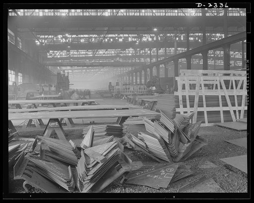 Shipbuilding. "Liberty" ships. Knee brackets ready to be welded between the ship's deck beams and frames ( or ribs) at the start of the production line. All parts are prefabricated in this huge Eastern plant which formerly turned out freight cars. The completed sections are then carried six miles to