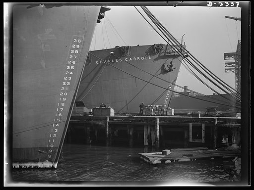 Shipbuilding. "Liberty" ships. Here are two members of the Liberty Fleet lying at anchor in the basin of a large eastern shipyard, awaiting final fitting and rigging. Bethlehem-Fairfield Shipyards Inc., Baltimore, Maryland