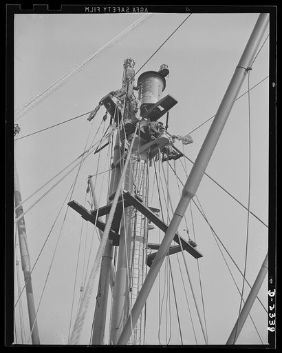 Shipbuilding. "Liberty" ships. These workers are making the final fitting and checking of the rigging of the masthead of a new member of the "Liberty Fleet" at a large Eastern shipyard. Bethlehem-Fairfield Shipyards Inc., Baltimore, Maryland