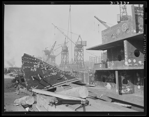 Shipbuilding. "Liberty" ships. Here are prefabricated tanks and deck girder sections ready to be hoisted up and set in their place in one of the new merchant ships under construction in a large Eastern shipyard. Bethlehem-Fairfield Shipyards Inc., Baltimore, Maryland