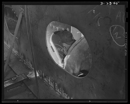Shipbuilding. "Liberty" ships. Welding is one of the most important advances of the century in shipbuilding, saving time, steel and weight. This welder is working on the inside of a fuel tank in a ship of Uncle Sam's new "Liberty Fleet." All parts are prefabricated in this huge Eastern plant which f