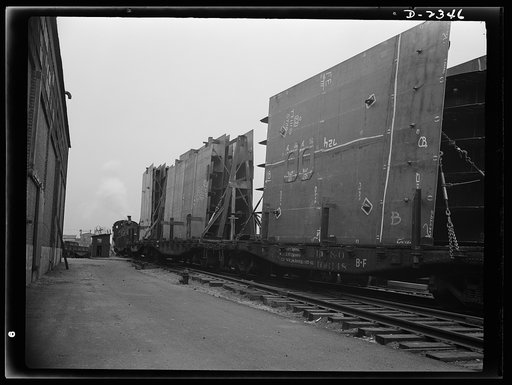 Shipbuilding. "Liberty" ships. These flat cars loaded with prefabricated and assembled sections for ships under construction at a large Eastern yard are leaving nearby plant formerly used for the manufacture of Pullman cars. The work of this plant means many valuable months saved in building of Uncl