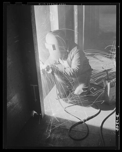 Shipbuilding. "Liberty" ships. Welding is one of the most important advances in shipbuilding during the present century, with the resulting in immense savings in time, material and weight in the building of ships. This welder is joining side plates to angle frames forming sections of the propeller s