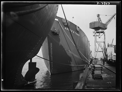 Shipbuilding. "Liberty" ships. Here are two members of the Liberty Fleet lying at anchor in the basin of an Eastern shipyard, awaiting final fitting and rigging. Bethlehem-Fairfield Shipyards Inc., Baltimore, Maryland