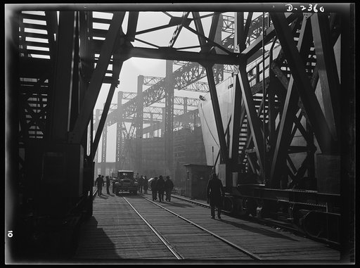 Shipbuilding. "Liberty" ships. Between the ways of this large Eastern shipyard run tracks for flat cars carrying materials or sections to be hoisted onto the deck of ships under construction