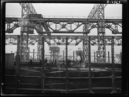 Shipbuilding. "Liberty" ships. In the foreground is the track of a two-direction overhead crane, while in the background may be seen more flexible modern cranes. Bethlehem-Fairfield Shipyards Inc., Baltimore, Maryland